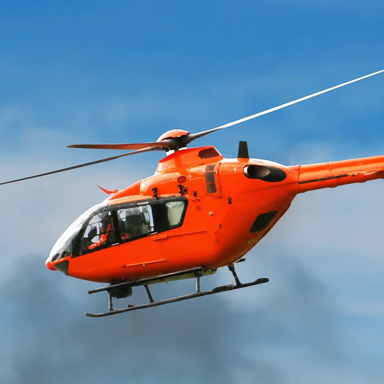 Helicopter Riding at Sonagarh Fort Resort — Helicopter in flight against a blue sky