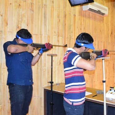 Rifle Shooting Range at Sonagarh Fort Resort — Guests at the indoor rifle shooting range